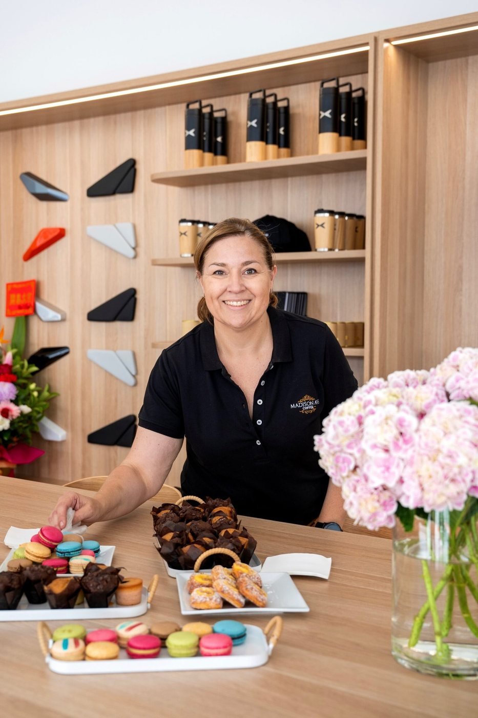 Deanne from Madison Ave Coffee with pastries and specialty coffee